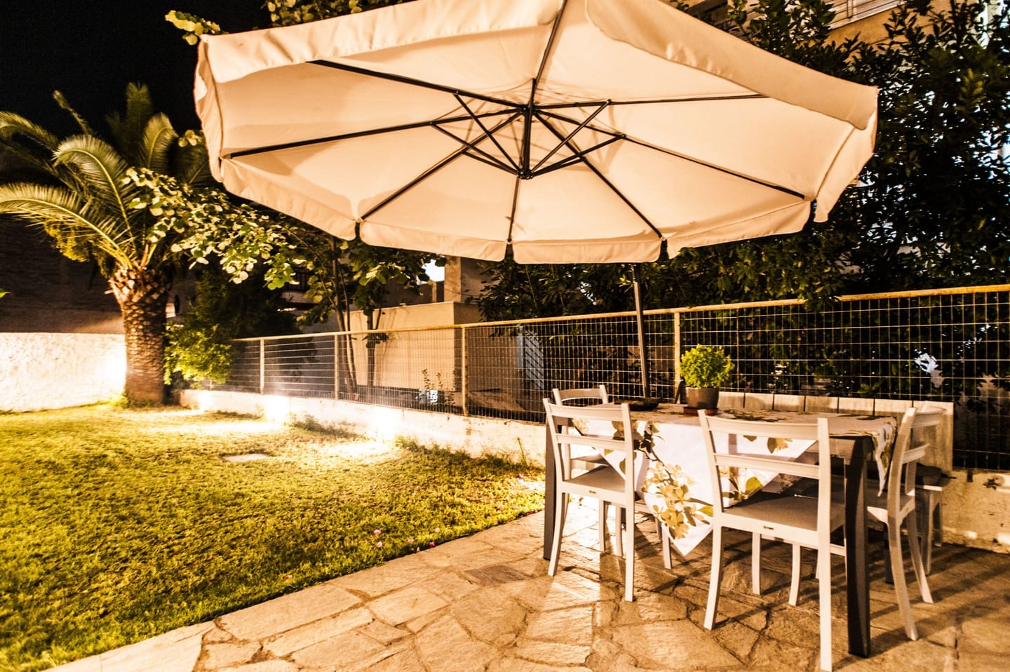 Garden table under the umbrella at night