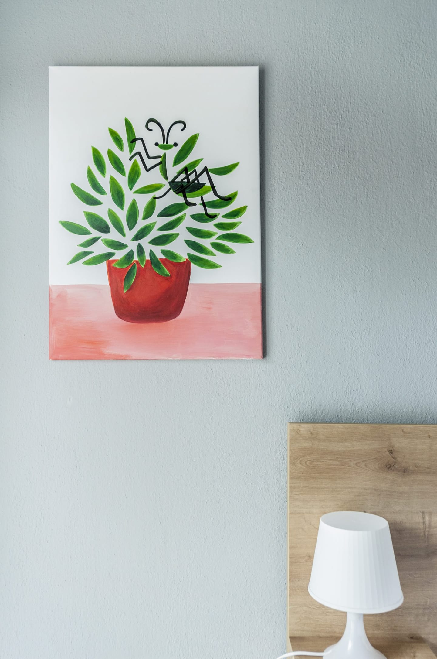 Painting of a plant in a red pot