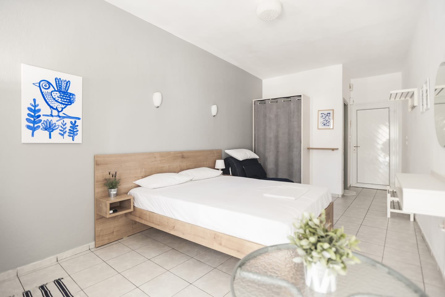 Studio with double bed and wardrobe curtain
