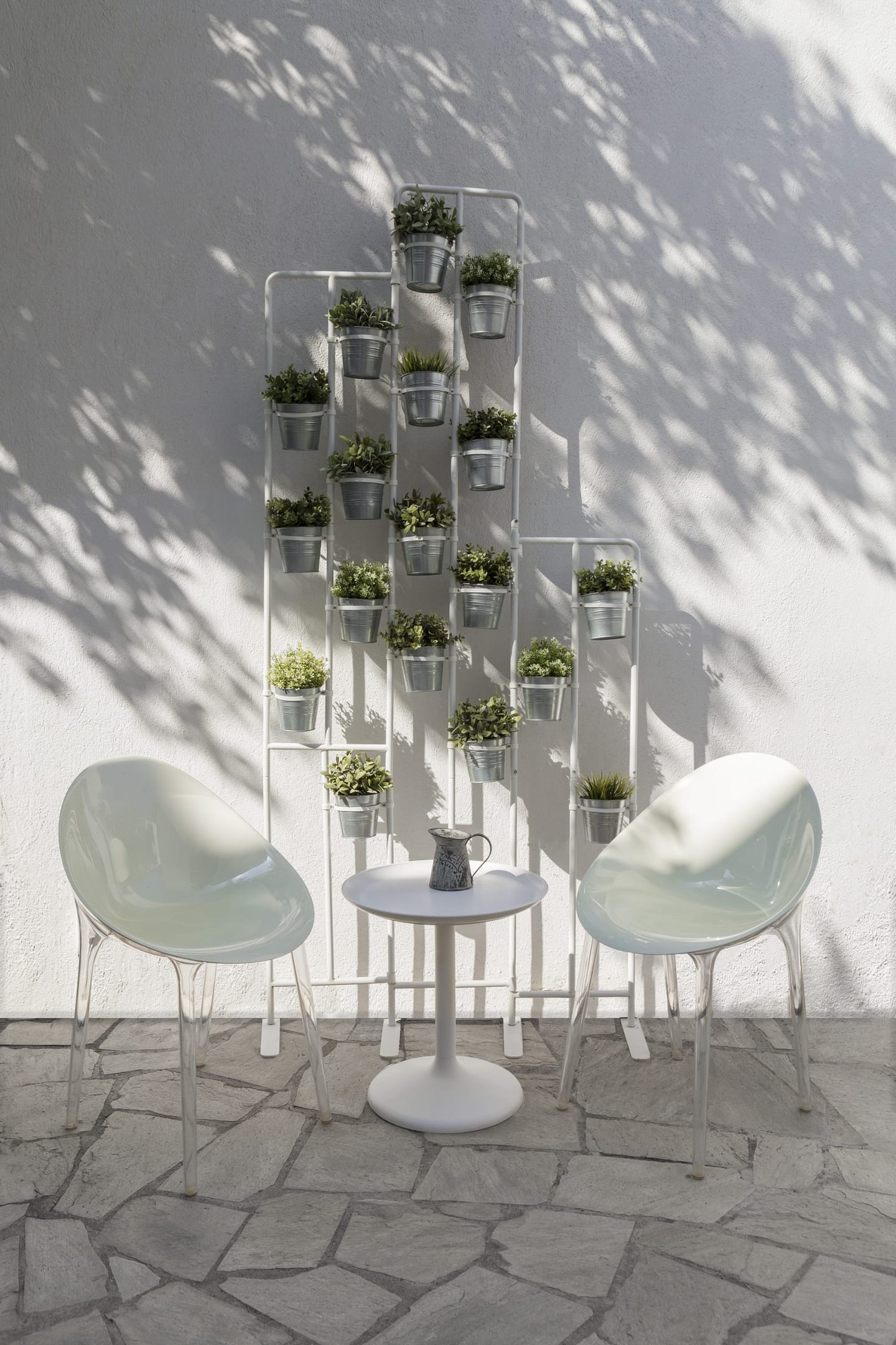 Chairs and hanging planters in the yard